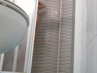 Spying on flirty Wife Shaving Pussy in Shower